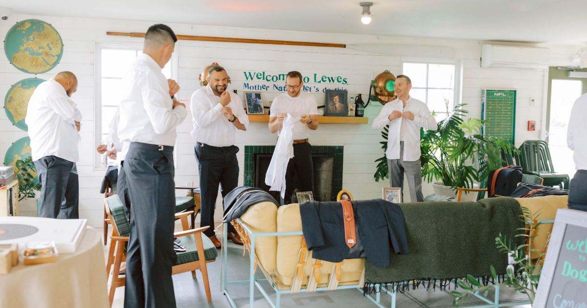 Dogfish Head Weddings - Love is INN the Air 27 A group of groomsmen getting ready in the dogfish inn