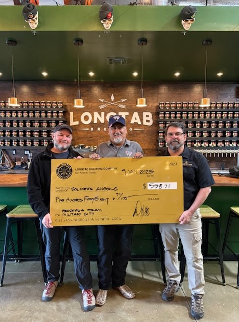 Longtab Brewing Renews Partnership with Soldiers’ Angels for 2025 10 A group of men holding a large checkDescription automatically generated