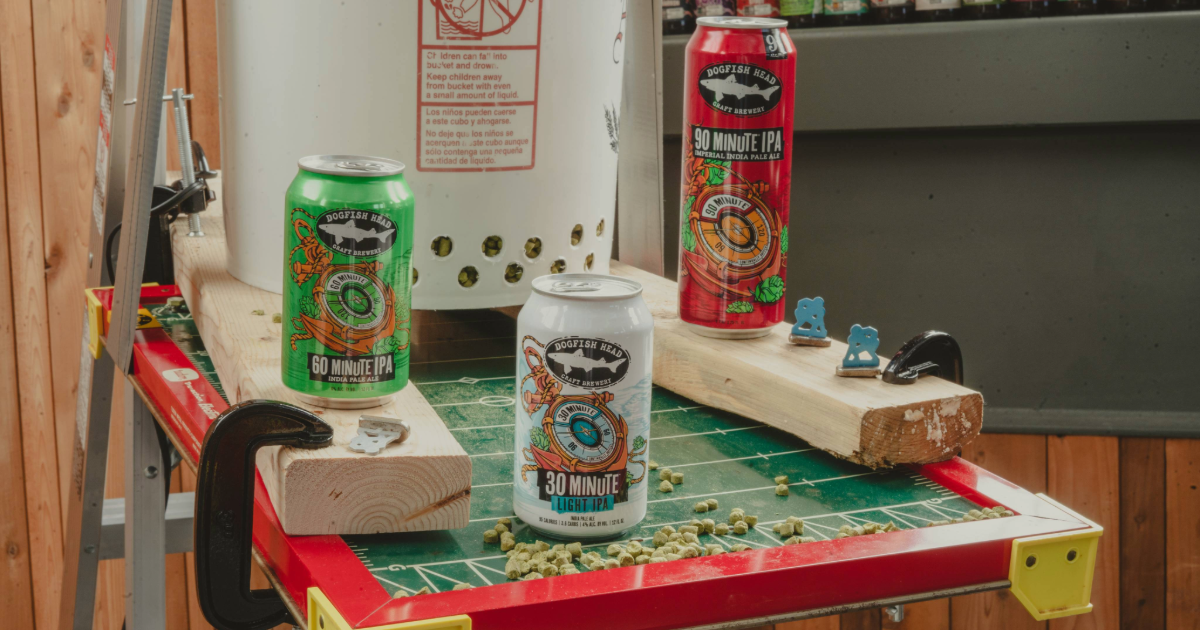 Dogfish Head Adding 30 Minute Light IPA 13 Dogfish Head 30, 60 and 90 Minute IPAs on a vibrating football game with hop pellets around them
