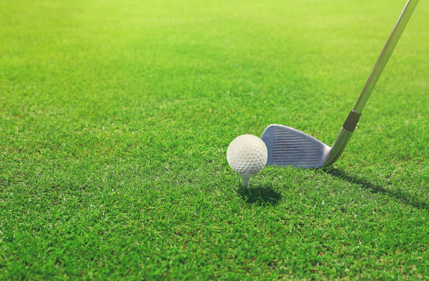 A golfer is playing golf in a top golf course in Las Vegas, Nevada A golfer is playing golf in a top golf course in Las Vegas, Nevada