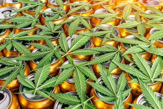 Hemp-infused seltzer cans with cannabis leaves
