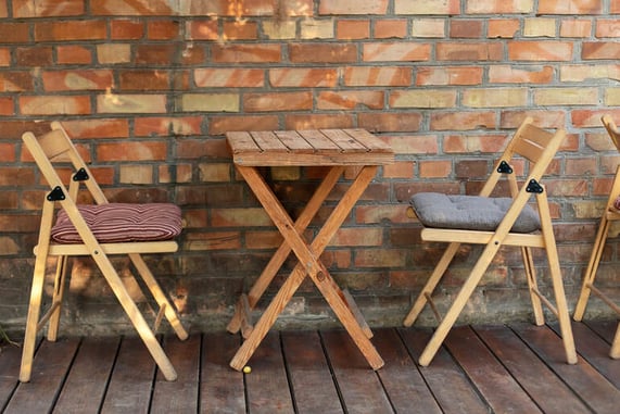 The close-up view of French bistro chairs styled inside an American brewery setting