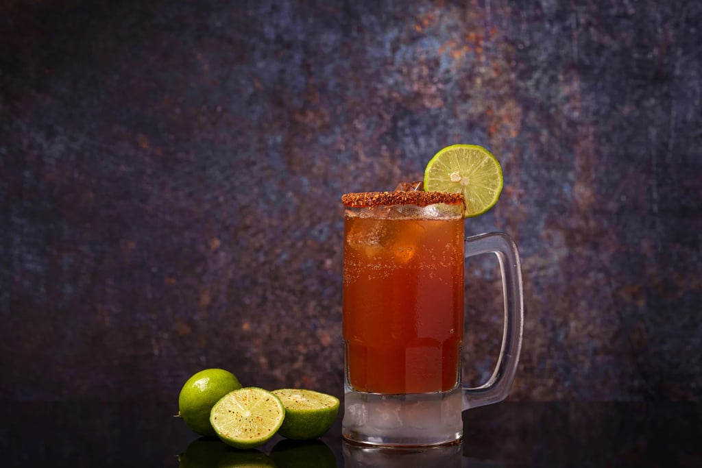A glass mug of a Classic Michelada with leamon.