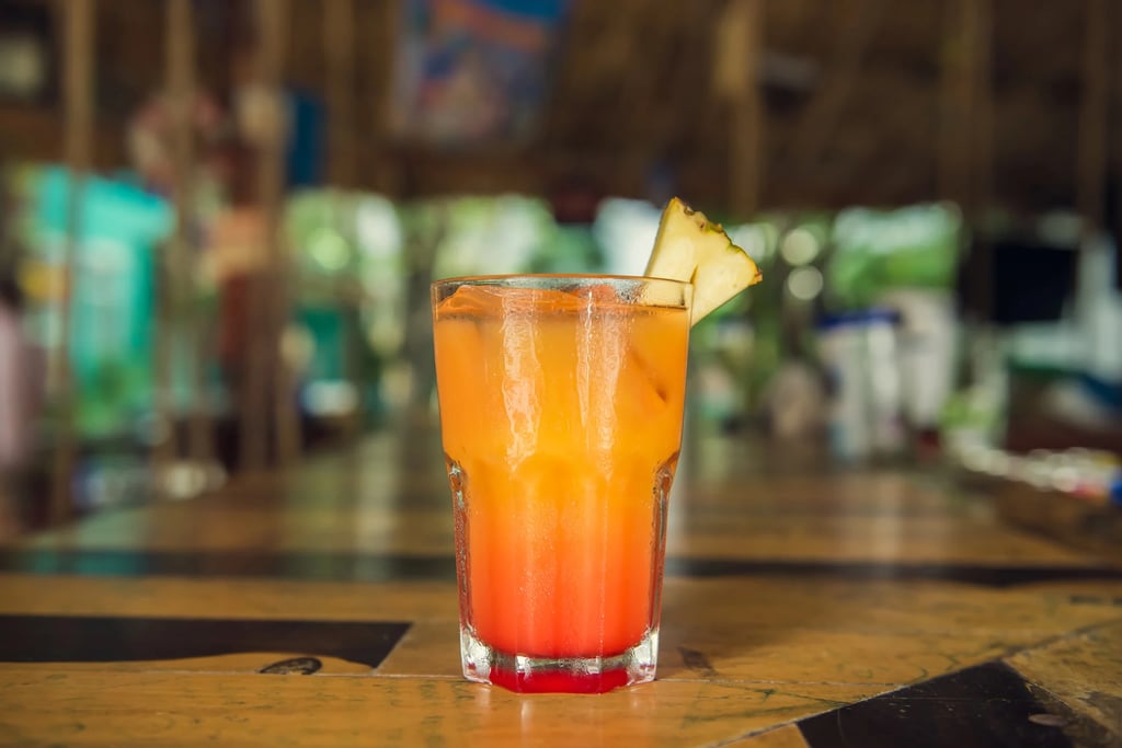 A glass of a Pineapple Jalapeño Michelada.