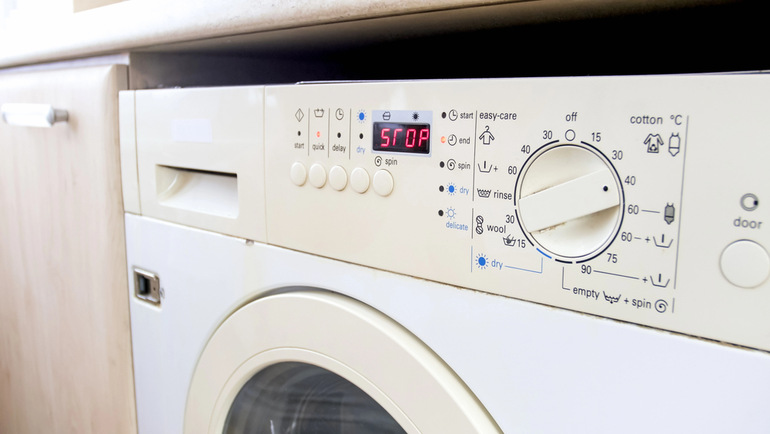Miele washing machine control panel displaying an error code on its digital screen.