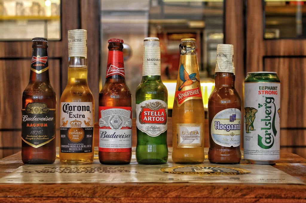 What Are Domestic Beers? Popular American Brands Explained 18 Domestic and imported beer displayed on a table