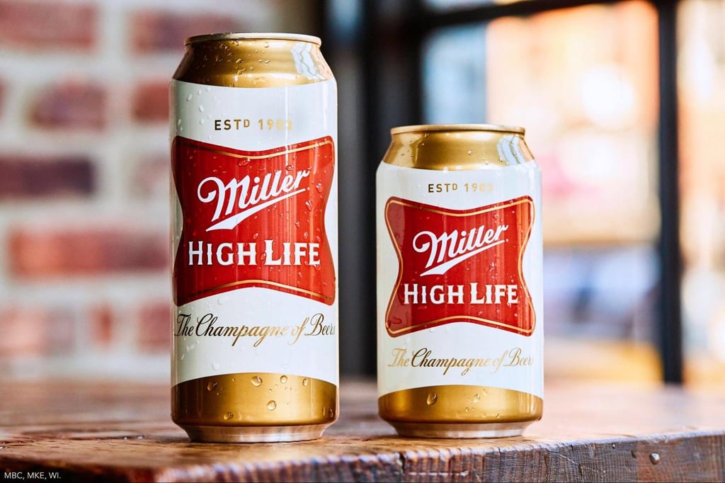 What Are Domestic Beers? Popular American Brands Explained 14 A tallboy and 12 oz can of Miller High Life sitting on a table